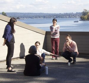 participants deliberate on sunny patio