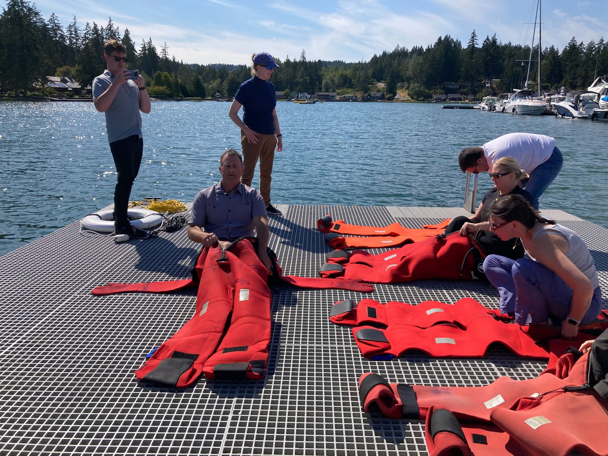 Students at WSG's sea safety class put on survival suit