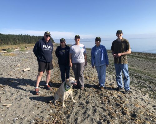 The team and Yuko posing in the beach in 2021. Photo credit: Emily Grason