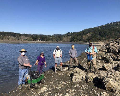 Chuckanut Bay team members soaking in some rays during their early season monitoring. Photo credit: Emily Grason