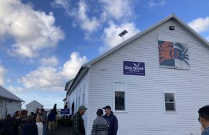 Bendiksen Landing South Bend office outside view - two signs read “Sea Grant Washington” and “South Bend, WA” with artwork of a crab