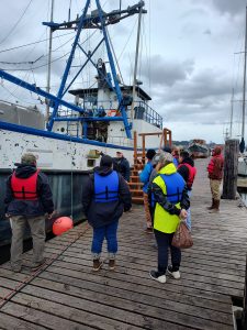 Skills and Drills students near one of the practice boats