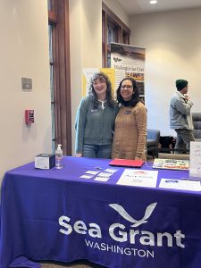 WSG staff at an outreach table at the 2025 Shellfish Growers Conference