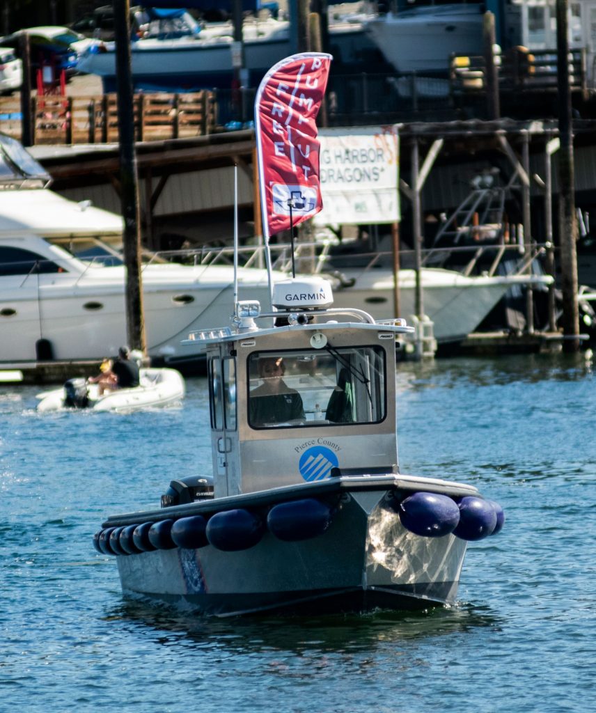 A mobile pumpout boat with a banner on top that reads"Free Pumpout"