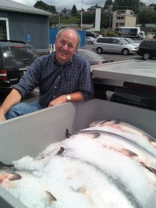 Robert Sudar poses with salmon on ice