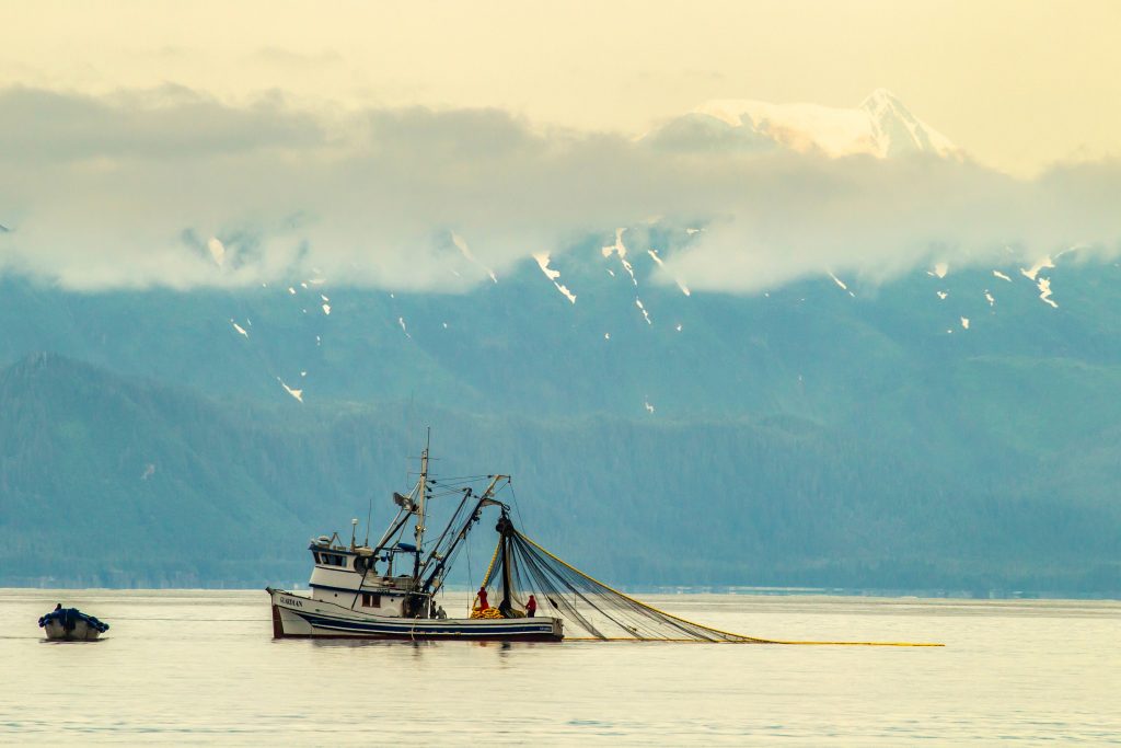 Fishing boat with mountains in the background